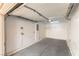 Clean, well-lit garage with finished walls, concrete floor, and an automatic door opener at 7923 Homer Ct, Las Vegas, NV 89139