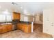 Modern kitchen offering granite counters, stainless appliances, and seamless flow into the adjacent living spaces at 7923 Homer Ct, Las Vegas, NV 89139