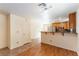 Open-concept kitchen boasting stainless steel appliances, breakfast bar, and stylish cabinetry at 7923 Homer Ct, Las Vegas, NV 89139