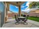 Inviting outdoor space with stylish patio furniture and lush synthetic grass at 8128 Devils Canyon St, North Las Vegas, NV 89085