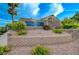 Lainwell community entrance sign surrounded by beautiful landscaping and a secure, inviting atmosphere at 8128 Devils Canyon St, North Las Vegas, NV 89085