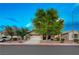 Charming single-story home featuring mature trees, a two-car garage, and well-maintained landscaping at 8128 Devils Canyon St, North Las Vegas, NV 89085
