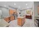 Spacious kitchen featuring granite countertops, stainless steel appliances, light wood cabinetry and recessed lighting at 8128 Devils Canyon St, North Las Vegas, NV 89085