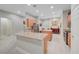 Bright kitchen features two islands, stainless steel appliances, light wood cabinets and tile floors at 8128 Devils Canyon St, North Las Vegas, NV 89085