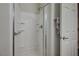 Clean shower stall featuring built-in shelving at 8128 Devils Canyon St, North Las Vegas, NV 89085