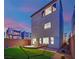 Cozy backyard with a hammock, patio, and view of modern townhome at 8178 Eaton Hill St, Las Vegas, NV 89113