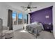 Bedroom with a ceiling fan and three windows provides ample natural light at 8178 Eaton Hill St, Las Vegas, NV 89113