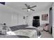 Bedroom with ceiling fan, large closet, and upholstered chair at 8178 Eaton Hill St, Las Vegas, NV 89113