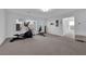 Large bonus room features neutral carpet, recessed lighting, and ample natural light from multiple windows at 8178 Eaton Hill St, Las Vegas, NV 89113
