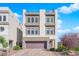Stylish three-story home with a private rooftop deck, showcasing contemporary design and desert-friendly landscaping at 8178 Eaton Hill St, Las Vegas, NV 89113