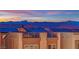 Modern home featuring rooftop solar panels and multiple balconies with scenic mountain views at 8178 Eaton Hill St, Las Vegas, NV 89113