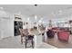 Bright, open-concept kitchen with granite counters and stainless steel appliances flowing into a cozy living space at 8178 Eaton Hill St, Las Vegas, NV 89113
