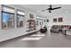 Bright living room with large windows offering neighborhood views and custom shelving at 8178 Eaton Hill St, Las Vegas, NV 89113