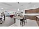 Open-concept with kitchen and living area with island and seating at 8178 Eaton Hill St, Las Vegas, NV 89113