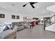 Open-concept living area with stylish furnishings and access to the modern kitchen at 8178 Eaton Hill St, Las Vegas, NV 89113