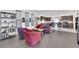 Open-concept living area with seating and view into kitchen and breakfast bar at 8178 Eaton Hill St, Las Vegas, NV 89113