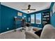 Home office space with ceiling fan, windows, desk, and comfortable seating at 8178 Eaton Hill St, Las Vegas, NV 89113