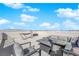 Open rooftop patio furnished with a cozy seating area and a modern fire pit, perfect for evening gatherings at 8178 Eaton Hill St, Las Vegas, NV 89113