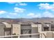 Scenic rooftop view showcasing the surrounding neighborhood and distant mountain landscape under a blue sky at 8178 Eaton Hill St, Las Vegas, NV 89113