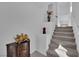 Carpeted staircase leads to the upper level, complemented by decorative accents and neutral tones at 8178 Eaton Hill St, Las Vegas, NV 89113