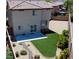 A private backyard, featuring artificial turf, a patio, and low-maintenance landscaping at 8682 Gateway Glen Dr, Las Vegas, NV 89178