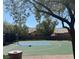 Outdoor basketball court surrounded by lush landscaping and fencing offering a space for recreational play at 8682 Gateway Glen Dr, Las Vegas, NV 89178