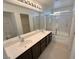 Primary bathroom with dual sinks, separate shower and walk-in closet at 8682 Gateway Glen Dr, Las Vegas, NV 89178