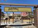 Welcoming community park entrance with a 'Howdy Neighbors' sign, playground equipment, and scenic mountain views at 8682 Gateway Glen Dr, Las Vegas, NV 89178