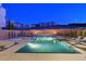 A stunning backyard pool area with a spa, lounge chairs, and manicured greenery, offering a serene outdoor retreat at 881 Barrhead Ave, Henderson, NV 89012