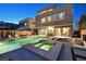 Gorgeous backyard with a modern pool, spa, patio, and landscaping, perfect for outdoor living and entertaining at 881 Barrhead Ave, Henderson, NV 89012