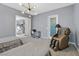 Bedroom with an unique chandelier, massage chair, and two beds at 881 Barrhead Ave, Henderson, NV 89012