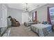 Bedroom featuring two twin beds, massage chair, and window with natural light at 881 Barrhead Ave, Henderson, NV 89012
