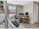 Upstairs office space with large window and a live edge desk overlooking backyard at 881 Barrhead Ave, Henderson, NV 89012