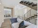 Upstairs living area with modern staircase and comfortable seating at 881 Barrhead Ave, Henderson, NV 89012