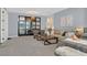 Elegant living area with a cozy sofa, stylish decor, and access to a bedroom, perfect for relaxation at 881 Barrhead Ave, Henderson, NV 89012