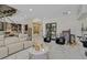 Open living room featuring a modern staircase, sleek furniture, and marble floors at 881 Barrhead Ave, Henderson, NV 89012