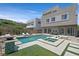 Lush backyard oasis with pool, spa, and outdoor seating, perfect for relaxation at 881 Barrhead Ave, Henderson, NV 89012