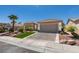 Inviting home with desert landscaping, a tile roof, and an attached two-car garage at 9425 Villa Ridge Dr, Las Vegas, NV 89134