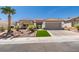 Charming home with desert landscaping, a tile roof, and an attached two-car garage at 9425 Villa Ridge Dr, Las Vegas, NV 89134