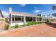 Beautiful home showcasing an expansive backyard, covered patio, mature landscaping, and tiled roof at 9425 Villa Ridge Dr, Las Vegas, NV 89134