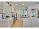 Spacious kitchen with stainless steel appliances, white cabinets, and quartz countertops at 9425 Villa Ridge Dr, Las Vegas, NV 89134