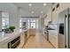Bright kitchen features stainless steel appliances, white cabinets, and spacious countertops at 9425 Villa Ridge Dr, Las Vegas, NV 89134