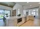 Open concept kitchen with a large island, modern appliances, and a breakfast nook at 9425 Villa Ridge Dr, Las Vegas, NV 89134