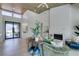 Bright living room featuring a modern fireplace, vaulted ceiling, and stylish decor at 9425 Villa Ridge Dr, Las Vegas, NV 89134
