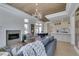 Bright living room features fireplace, golf course views, and an open concept layout at 9425 Villa Ridge Dr, Las Vegas, NV 89134