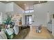 Open concept living area with a kitchen, modern decor, and bright natural light at 9425 Villa Ridge Dr, Las Vegas, NV 89134