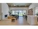 Open living room with fireplace, modern decor, and views of the lush green golf course at 9425 Villa Ridge Dr, Las Vegas, NV 89134