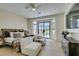 A serene main bedroom with large windows and stylish furnishings at 9425 Villa Ridge Dr, Las Vegas, NV 89134