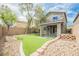 Picturesque backyard with artificial turf, stone landscaping, and a covered patio for outdoor enjoyment at 9545 Parker Springs Ct, Las Vegas, NV 89166