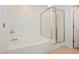 Bright bathroom featuring a soaking tub and glass-enclosed shower, providing a luxurious spa-like experience at 9545 Parker Springs Ct, Las Vegas, NV 89166